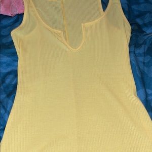 Yellow shorts jumpsuit with slit in front